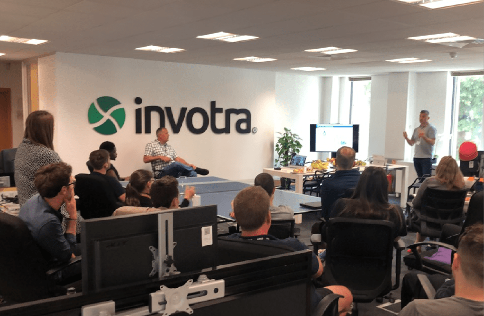 Photograph of the Invotra team listening to Neil Owen's presentation on Giving employees a voice