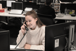 Invotra employee Georgia, on a phone call in our Woking office